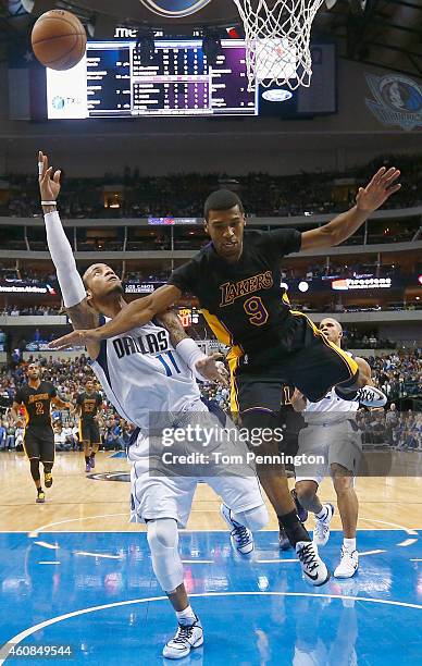 Monta Ellis of the Dallas Mavericks shoots the ball against Ronnie Price of the Los Angeles Lakers in the secodn half at American Airlines Center on...