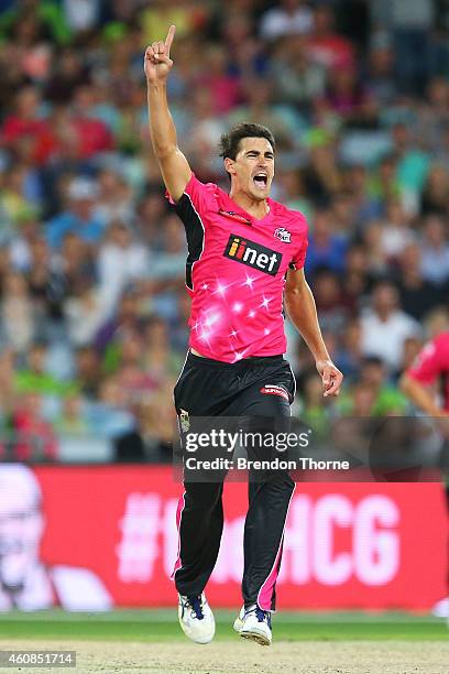 Mitch Starc of the Sixers celebrates after claiming the wicket of Jacques Kallis of the Thunder during the Big Bash League match between the Sydney...