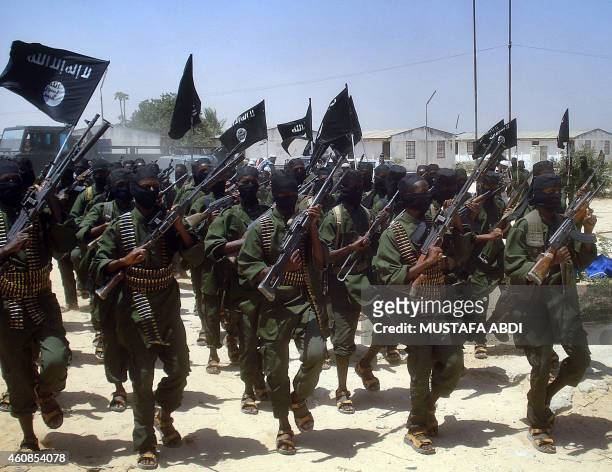 Islamist fighters loyal to Somalia's Al-Qaida inspired al-Shebab group perform military drills at a village in Lower Shabelle region, some 25...