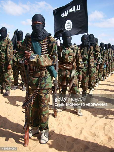 Somali Al-Shebab fighters gather on February 13, 2012 in Elasha Biyaha, in the Afgoei Corridor, after a demonstration to support the merger of...