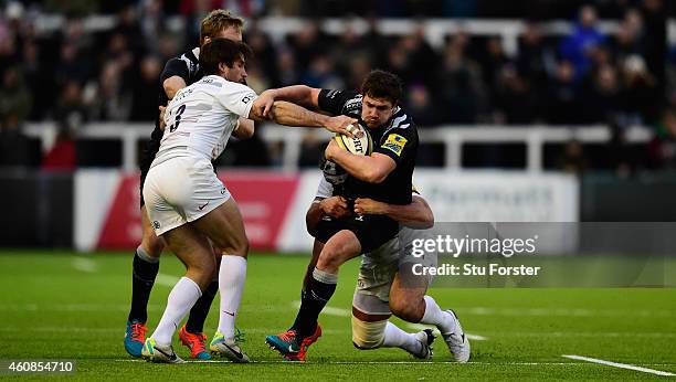 Falcons centre Adam Powell attempts to break the gain line during the Aviva Premiership match between Newcastle Falcons and Saracens at Kingston Park...