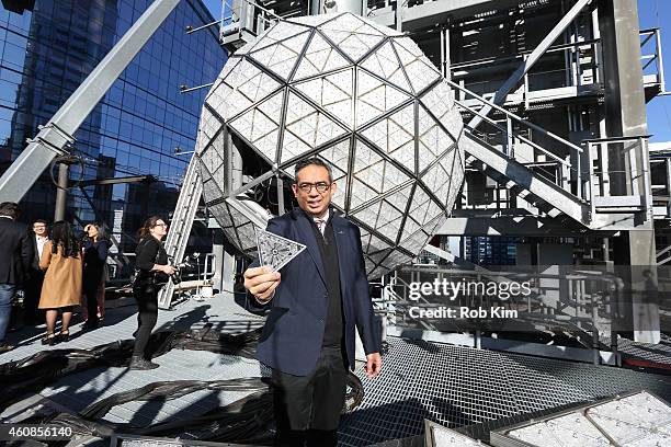 Regan Iglesia, SVP Global Brand Director, Waterford holds up a Waterford Crystal at the 2015 New Year's Eve Waterford Crystal Installation at One...