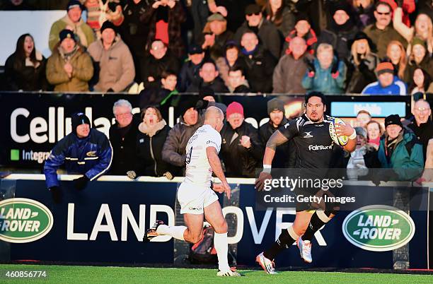 Falcons winger Alesana Tuilagi tears past Charlie Hodgson during the Aviva Premiership match between Newcastle Falcons and Saracens at Kingston Park...