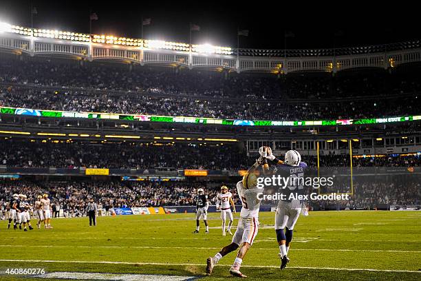 Kyle Carter of the Penn State Nittany Lions makes a touchdown catch over Ty-Meer Brown of the Boston College Eagles in overtime of the 2014 New Era...