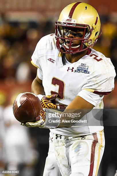 Tyler Murphy of the Boston College Eagles hands off the ball in the second half during a game against the Penn State Nittany Lions in the 2014 New...