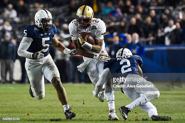 Tyler Murphy of the Boston College Eagles runs between Marcus Allen and Nyeem Wartman of the Penn State Nittany Lions in the fourth quarter of the...