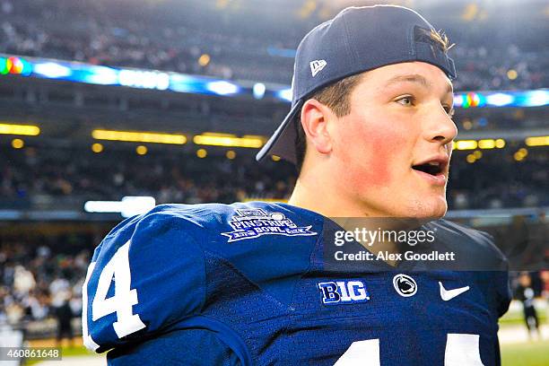 Christian Hackenberg of the Penn State Nittany Lions looks on after defeating the Boston College Eagles in the 2014 New Era Pinstripe Bowl at Yankee...