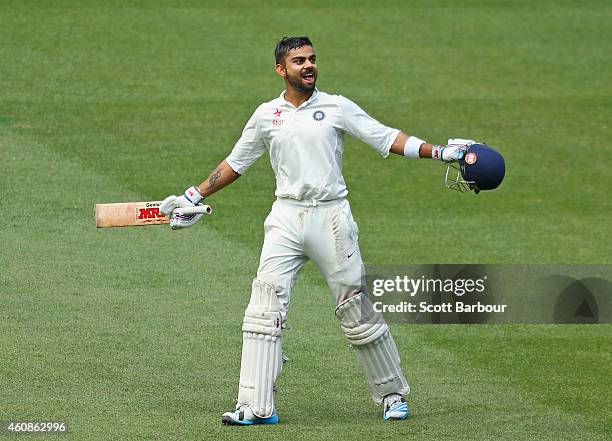Virat Kohli celebrates after reaching his century during day three of the Third Test match between Australia and India at Melbourne Cricket Ground on...
