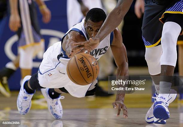 Thaddeus Young of the Minnesota Timberwolves dives for a loose ball against the Golden State Warriors at ORACLE Arena on December 27, 2014 in...