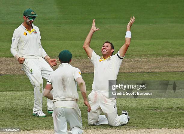 Ryan Harris of Australia celebrates after taking a caught and bowled to dismiss Ravichandran Ashwin of India during day three of the Third Test match...