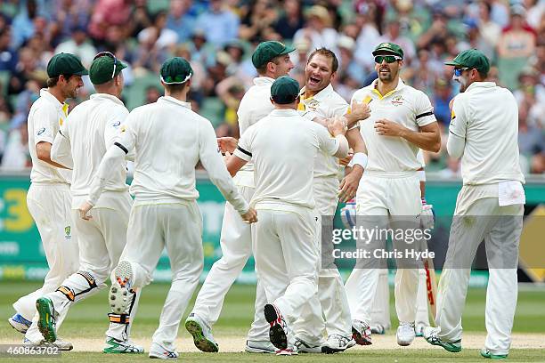 Ryan Harris of Australia celebrates with team mates after dismissing Ravichandran Ashwin of India during day three of the Third Test match between...