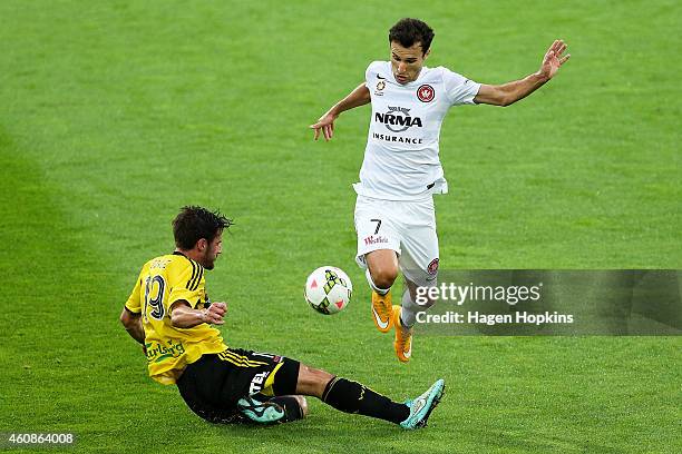 Labinot Haliti of the Wanderers is tackled by Tom Doyle of the Phoenix during the round 13 A-League match between the Wellington Phoenix and the...