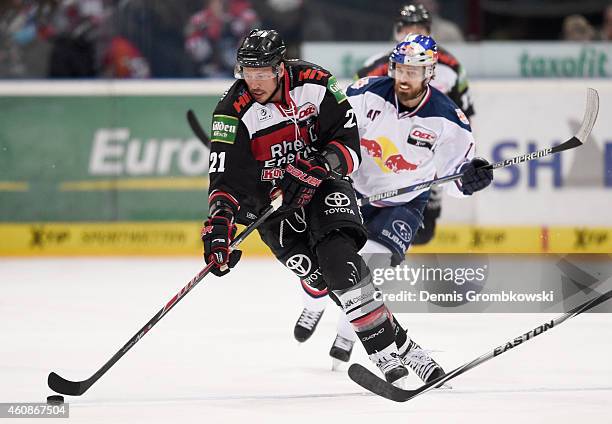 John Tripp of Koelner Haie controls the puck during the DEL Ice Hockey game between Koelner Haie and EHC Red Bull Muenchen at Lanxess Arena on...