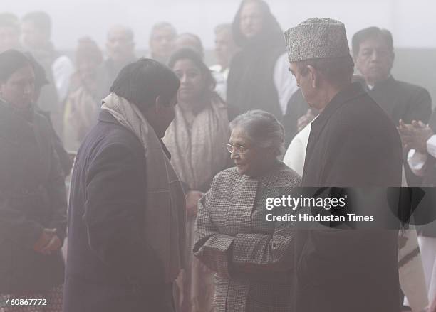 Congress leaders Ghulam Nabi Azad with Sheila Dikshit during Congress Partys 130th foundation day at AICC Headquarters during heavy fog on December...