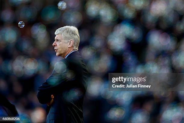 Arsene Wenger, manager of Arsenal looks on before the Barclays Premier League match between West Ham United and Arsenal at Boleyn Ground on December...