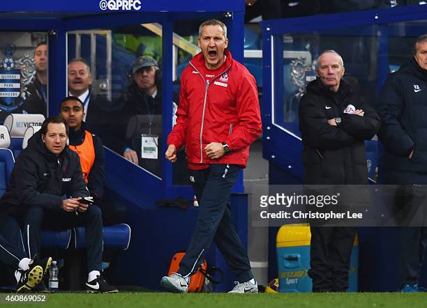 Keith Millen caretaker manager of Crystal Palace shouts from the touchline during the Barclays Premier League match between Queens Park Rangers and...