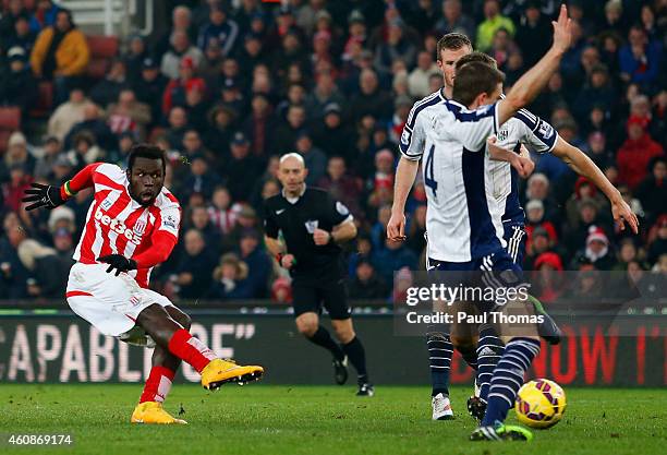 Mame Biram Diouf of Stoke City scores their first goal during the Barclays Premier League match between Stoke City and West Bromwich Albion at...