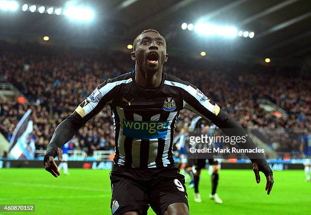 Papiss Demba Cisse of Newcastle United celebrates after scoring a goal to level the scores at 1-1 during the Barclays Premier League match between...