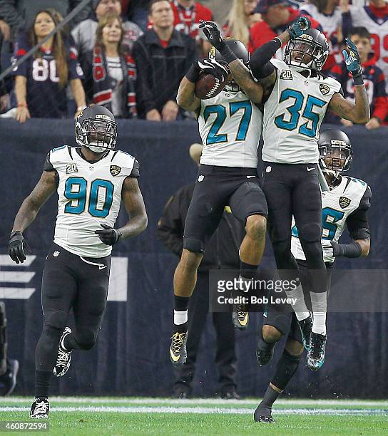 Andre Branch , Demetrius McCray celebrate Dwayne Gratz of the Jacksonville Jaguars touchdown against the Houston Texans in the first quarter in a NFL...