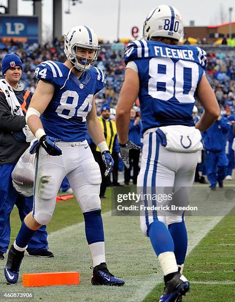 Tight end Jack Doyle is congratulated by teammate Coby Fleener after scoring a touchdown against the Tennessee Titans during the second quarter of a...