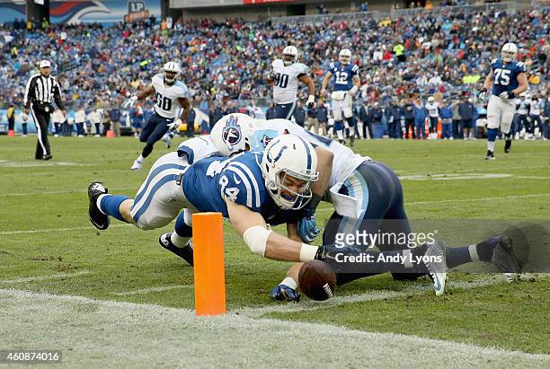 Jack Doyle of the Indianapolis Colts reaches to score a touchdown during the game against the Tennessee Titans at LP Field on December 28, 2014 in...