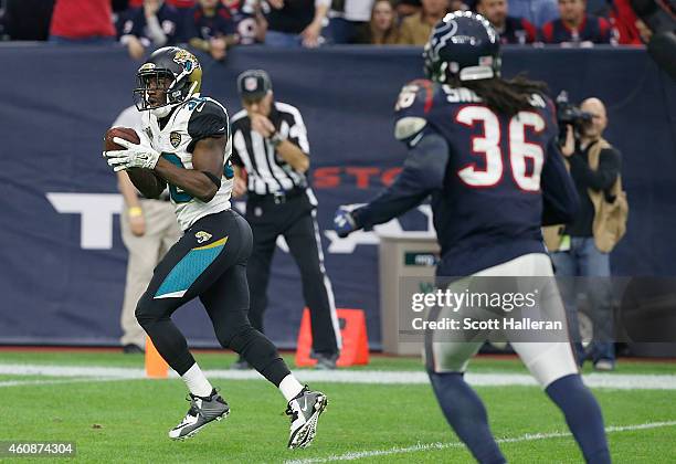Jordan Todman of the Jacksonville Jaguars scores a touchdown reception while D.J. Swearinger of the Houston Texans watches in the third quarter in a...