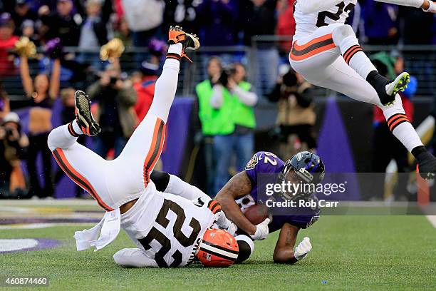 Wide receiver Torrey Smith of the Baltimore Ravens catches a fourth quarter touchdown pass over the defense cornerback Buster Skrine of the Cleveland...