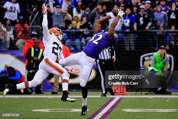 Wide receiver Torrey Smith of the Baltimore Ravens makes a fourth quarter catch past the defense of cornerback Joe Haden of the Cleveland Browns at...