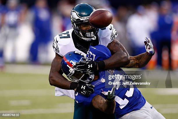 Odell Beckham of the New York Giants tries to make a catch as Malcolm Jenkins of the Philadelphia Eagles defends during a game at MetLife Stadium on...