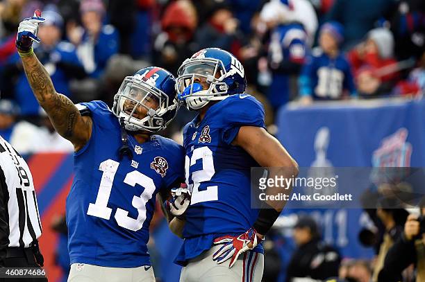 Odell Beckham and Rueben Randle of the New York Giants celebrate against the Philadelphia Eagles during a game at MetLife Stadium on December 28,...