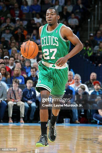 Jordan Crawford of the Boston Celtics handles the ball against the Oklahoma City Thunder on January 5, 2014 at the Chesapeake Energy Arena in...