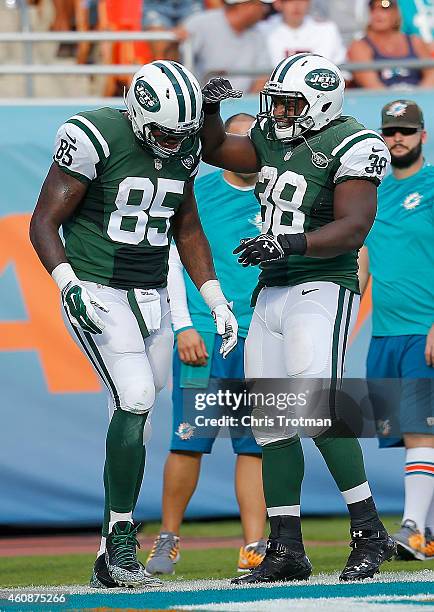 Tight end Jeff Cumberland of the New York Jets celebrates his fourth quarter touchdown with fullback John Conner of the New York Jets during a game...