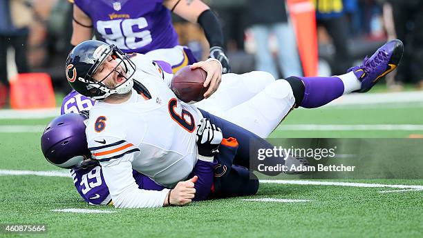 Corey Wootton of the Minnesota Vikings sacks Jay Cutler of the Chicago Bears during the fourth quarter on December 28, 2014 at TCF Bank Stadium in...