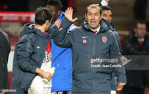 Head coach of Monaco Leonardo Jardim celebrates the victory with Bernardo Silva of Monaco at the end of the French Ligue 1 match between AS Monaco FC...