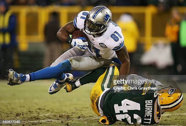 Calvin Johnson of the Detroit Lions scores a touchdown against the defense of Morgan Burnett of the Green Bay Packers in the second quarter at...