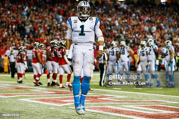 Cam Newton of the Carolina Panthers celebrates a touchdown in the first half against the Atlanta Falcons at the Georgia Dome on December 28, 2014 in...