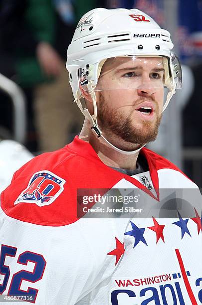 Mike Green of the Washington Capitals looks on during a break in the action against the New York Rangers at Madison Square Garden on December 23,...