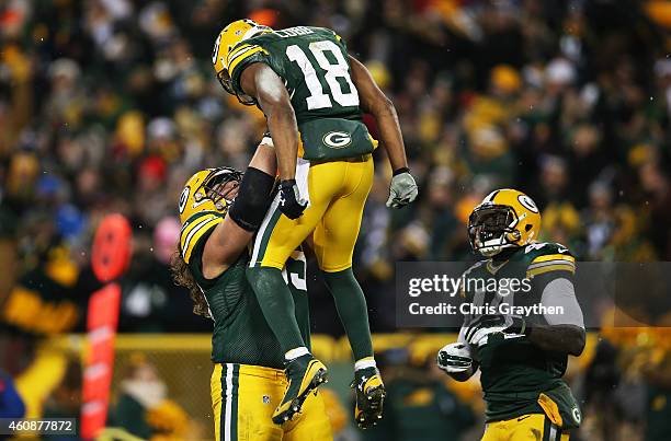 Randall Cobb celebrates his touchdown with David Bakhtiari of the Green Bay Packers in the third quarter against the Detroit Lions at Lambeau Field...