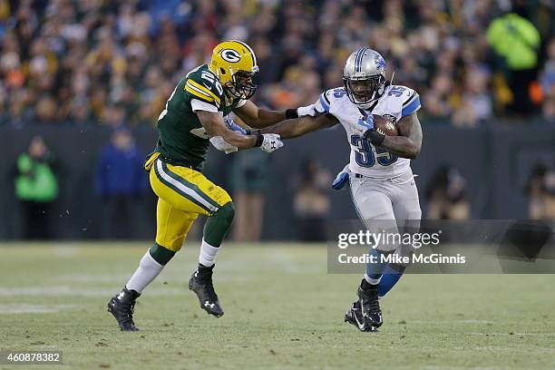 Running back Joique Bell of the Detroit Lions carries the football against safety Sean Richardson of the Green Bay Packers in the second half of the...