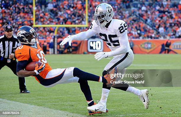 Denver Broncos wide receiver Emmanuel Sanders his knocked out of bounds by Oakland Raiders cornerback D.J. Hayden in the second quarter at Sports...