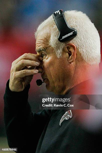 Head coach Mike Smith of the Atlanta Falcons reacts to a play in the second half against the Carolina Panthers at the Georgia Dome on December 28,...