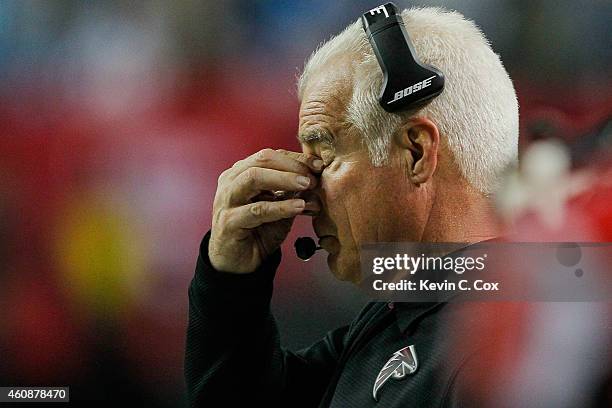 Head coach Mike Smith of the Atlanta Falcons reacts to a play in the second half against the Carolina Panthers at the Georgia Dome on December 28,...