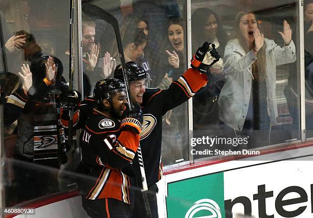 Cam Fowler of the Anaheim Ducks celebrates with Devante Smith-Pelly after scoring the game winning goal in overtime against the Vancouver Canucks at...