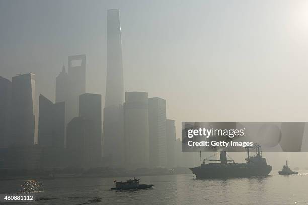 The Lujiazui Financial District and Huangpu River are engulfed in smog on December 29, 2014 in Shanghai, China. Shanghai's real-time Air pollution...