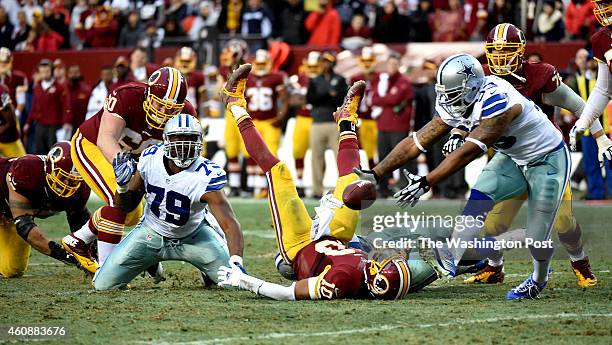 Dallas Cowboys defensive end Anthony Spencer plucks the ball out of midair and rumbles in for a touchdown on a fumble by Washington Redskins...