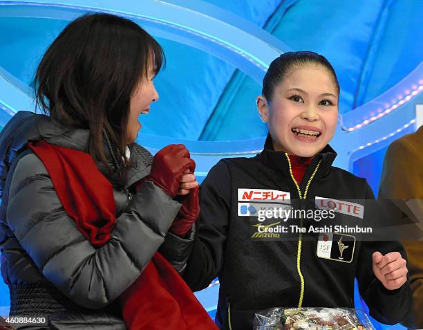 Satoko Miyahara celebrates her score at the kiss and cry after competing in the Ladies' Singles Free Program during day three of the 83rd All Japan...