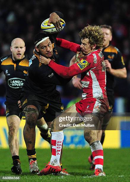 Nathan Hughes of Wasps fends off Billy Twelvetrees of Gloucester during the Aviva Premiership match between Gloucester Rugby and Wasps at Kingsholm...