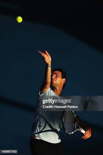 Adrian Mannarino of France serves against Jack Sock of the USA during day one of the Heineken Open at ASB Tennis Centre on January 6, 2014 in...