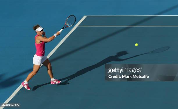 Sam Stosur of Australia plays a forehand in her first round match against Madison Brengle of the USA during day two of the Moorilla Hobart...