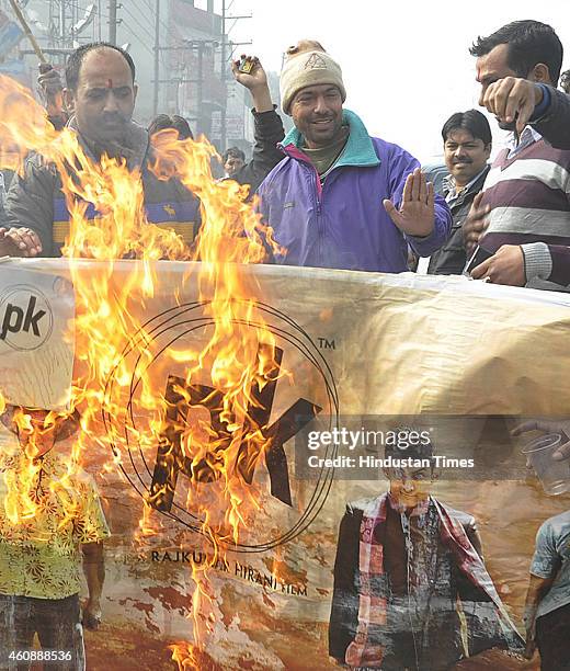 Activist of Hindu outfits burnt poster of Aamir Khan-starrer film PK outside theater on December 28, 2014 in Ghaziabad, India. Accusing Aamir...